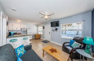 a living room with a couch and a table at Blue Water Beachside villa 2 in Clearwater Beach