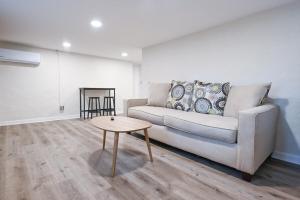 a living room with a couch and a table at Bobbin Mills Studio - 1 mile from Downtown Athens in Athens