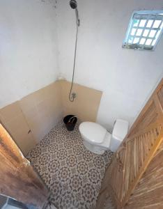 a bathroom with a toilet and a shower at Borac Bay View in Borac