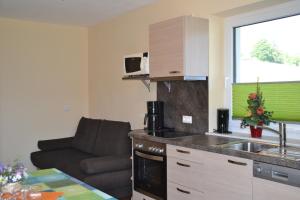 Kuchyň nebo kuchyňský kout v ubytování Appartements Real