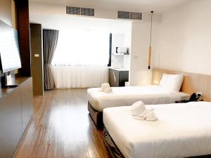 Postel nebo postele na pokoji v ubytování Grandview Residence