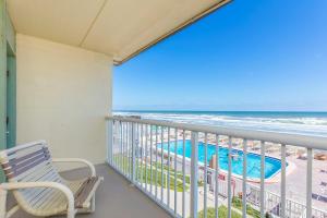 a balcony with a view of the beach and the ocean at Fantasy Island Resort I in Daytona Beach Shores