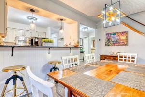 a kitchen and dining room with a table and chairs at Antler Ridge: 3BDR w Hot Tub & Game Room in Albrightsville +48 photos
