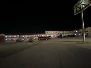 a parking lot in front of a building at night at Colonial Inn in Dyersville +5 photos