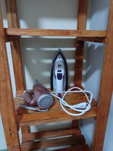 a wooden shelf with a microphone and a microphone at Lindo Loft na Cinelândia in Rio de Janeiro