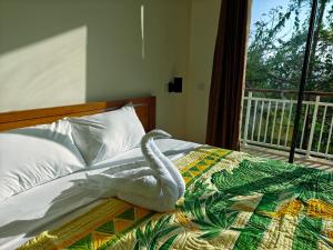 Postel nebo postele na pokoji v ubytování Jukung Dive Resort Bali PENIDA