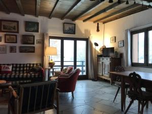 a living room with a couch and a table at Chalet Peisey-Nancroix-Plan Peisey, 6 pièces, 11 personnes - FR-1-757-78 in Peisey-Nancroix