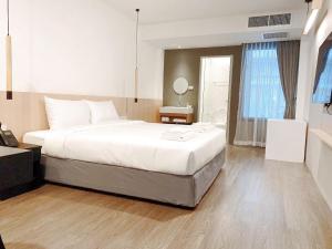 Postel nebo postele na pokoji v ubytování Grandview Residence
