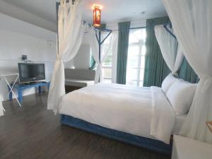 Voodi või voodid majutusasutuse Nanwan Chilling Villa toas