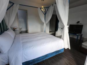 Voodi või voodid majutusasutuse Nanwan Chilling Villa toas