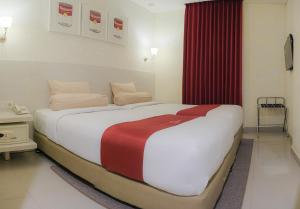 Ένα ή περισσότερα κρεβάτια σε δωμάτιο στο The Win Hotel Surabaya +21 φωτογραφίες