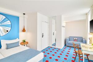 Ένα ή περισσότερα κρεβάτια σε δωμάτιο στο Hotel Joke - Astotel