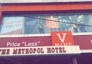 a sign in the window of a hotel at The Metropol Hotel Bihar in Siwān