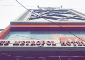 a sign on the side of a building at The Metropol Hotel Bihar in Siwān