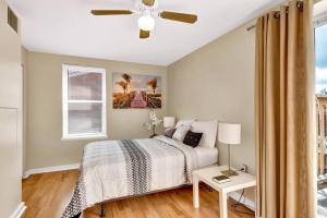 a bedroom with a bed and a ceiling fan at Lovely 1br Apartment In Rittenhouse Square in Philadelphia