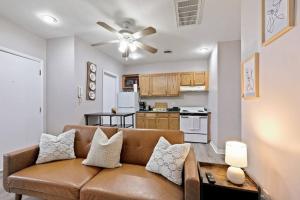 a living room with a couch and a kitchen at Stunning 2br Near Everything - City Center in Philadelphia