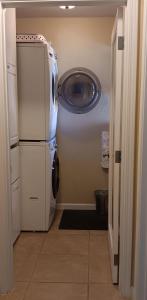 a washer and dryer in a laundry room with a washer at Arden Park Charm in Sacramento
