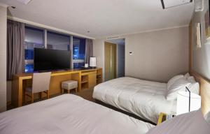 Letto o letti in una camera di Hotel Interciti