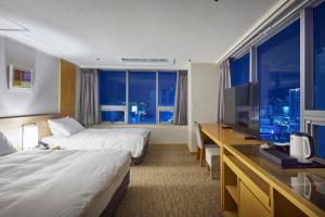 Letto o letti in una camera di Hotel Interciti