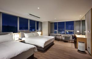 Letto o letti in una camera di Hotel Interciti