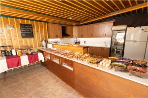 a kitchen with a lot of food on the counter at Maron Stone House in Göreme