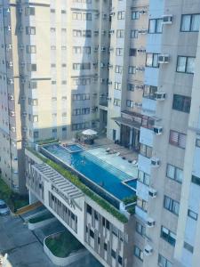 an aerial view of a building with a swimming pool at The Persimmon Studios Tower 3 Unit 1153 located in MJ Cuenco Cebu City in Cebu City