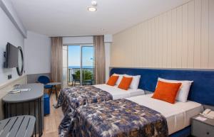 Postel nebo postele na pokoji v ubytování Monart City Hotel - All Inclusive Plus