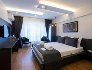 A bed or beds in a room at Kanarya Suite
