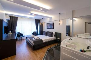 A bed or beds in a room at Kanarya Suite