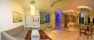 a living room with a couch and a table at Kleopatra Celine Hotel in Alanya