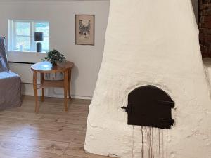 a pizza oven in a room with a table at 6 person holiday home in ASARUM-By Traum in Asarum