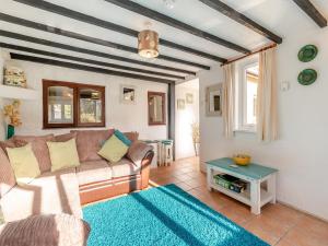 a living room with a couch and a table at Dairy Cottage-uk45593 in Verwick