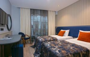 Postel nebo postele na pokoji v ubytování Monart City Hotel - All Inclusive Plus