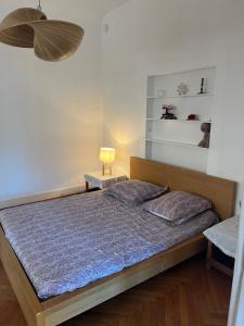 a bedroom with a bed and a lamp on a table at Coeur de Marseille in Marseille