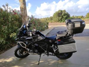 a motorcycle parked on the side of a road at Agriturismo Is Solinas in Masainas