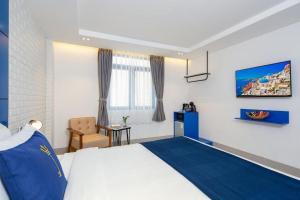 Postel nebo postele na pokoji v ubytování Lucia Beach Hotel