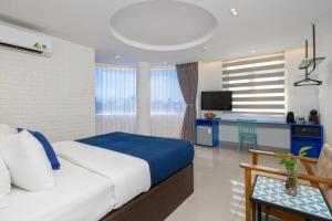 Postel nebo postele na pokoji v ubytování Lucia Beach Hotel