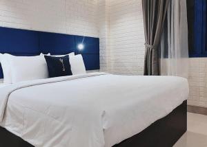 Postel nebo postele na pokoji v ubytování Lucia Beach Hotel