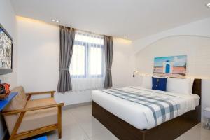 Postel nebo postele na pokoji v ubytování Lucia Beach Hotel