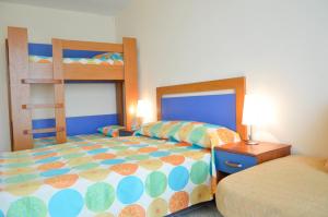 Postel nebo postele na pokoji v ubytování Hotel Laguna Mare + 17 fotografií
