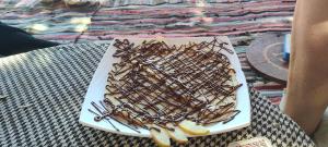 a plate of food on top of a table at Michael's House in Nuweiba