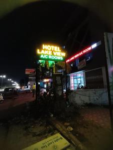 a motel lane wigwam as rooms at night at Hotel Lake View AC room in Vadodara