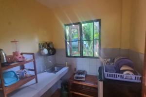 Posezení v ubytování Mountain Thai Style Chalet