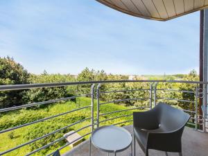 a balcony with two chairs and a table at Jachthaven II 3 bedrooms on floor 2 in Blankenberge