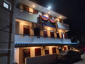 a building with a sign on the side of it at Hotel Sharma Residency Chennai Egmore in Chennai