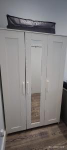 a white cabinet with a bed on top of it at Studio Flat / London Gateway in Borehamwood