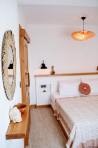 Postel nebo postele na pokoji v ubytování Kallinos Boutique Hotel