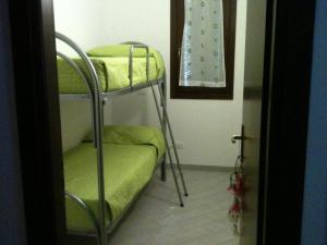 Postel nebo postele na pokoji v ubytování Appartamento Anna Maria