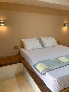 Voodi või voodid majutusasutuse Lombok Coconut Hotel toas