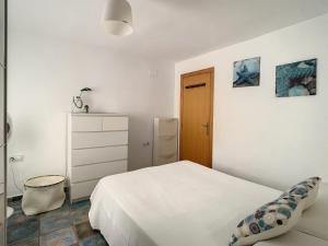 Posteľ alebo postele v izbe v ubytovaní La Casita del Faro